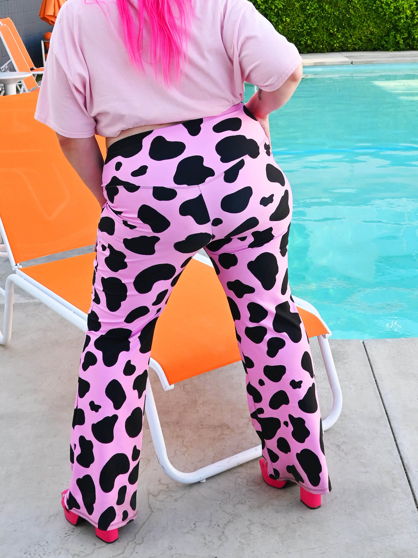 Pink maximalist plus size flare leggings.