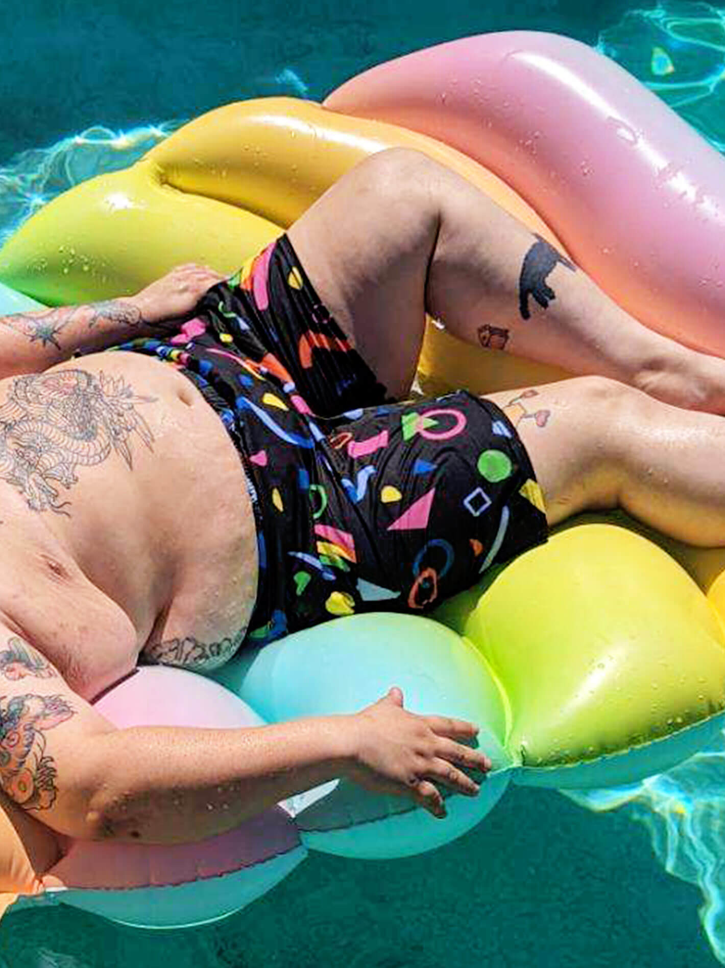Plus size confetti print swim trunks.